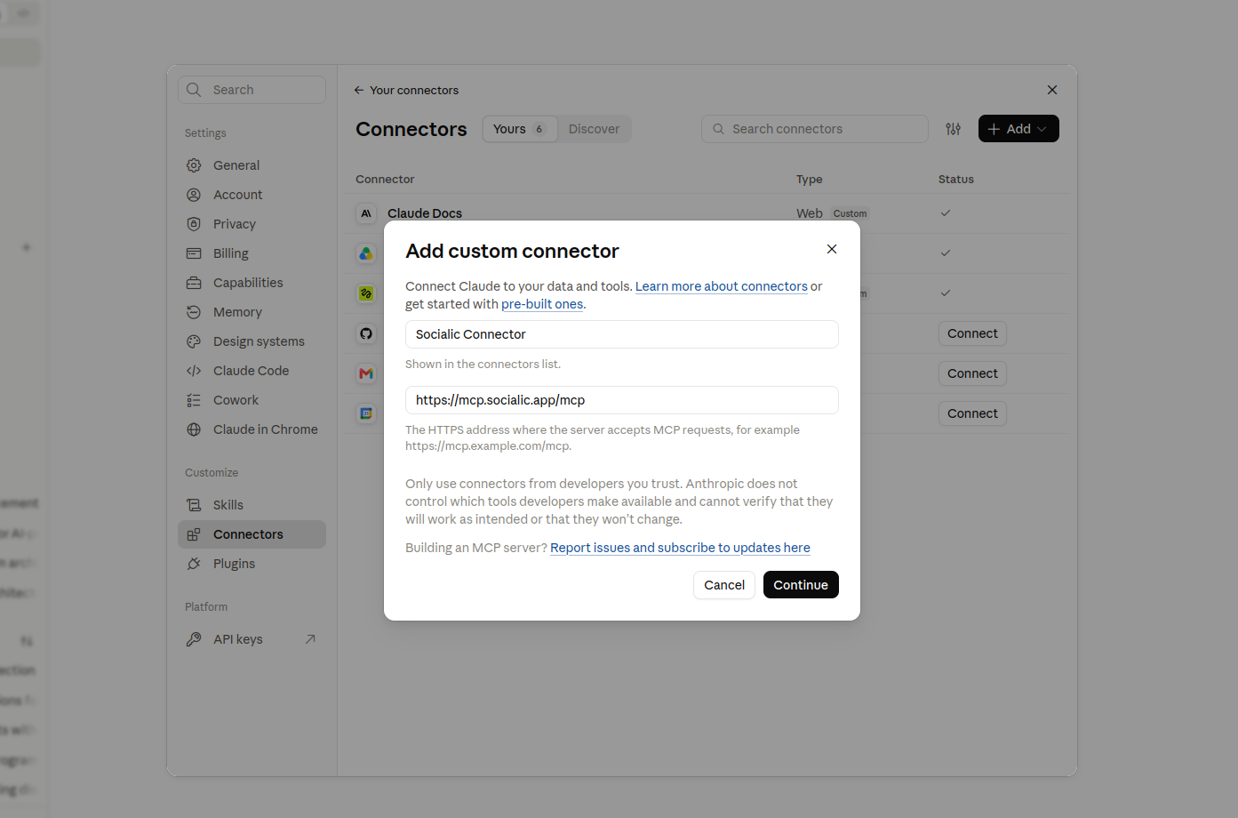 claude.ai's Add custom connector dialog, with the name 'Socialic Connector' and the URL https://mcp.socialic.app/mcp filled in, and a Continue button